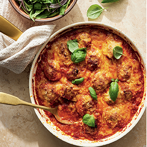Chicken parm meatballs in a white bowl 