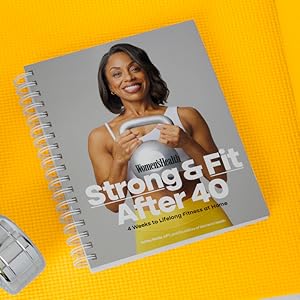 strong and fit after 40 on a yellow yoga mat surrounded by weights